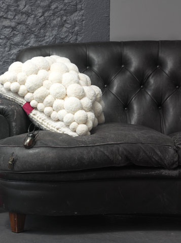MYK pom-pom cushion